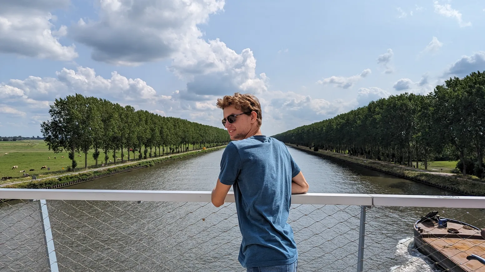Thomas Bood on a bridge over a canal